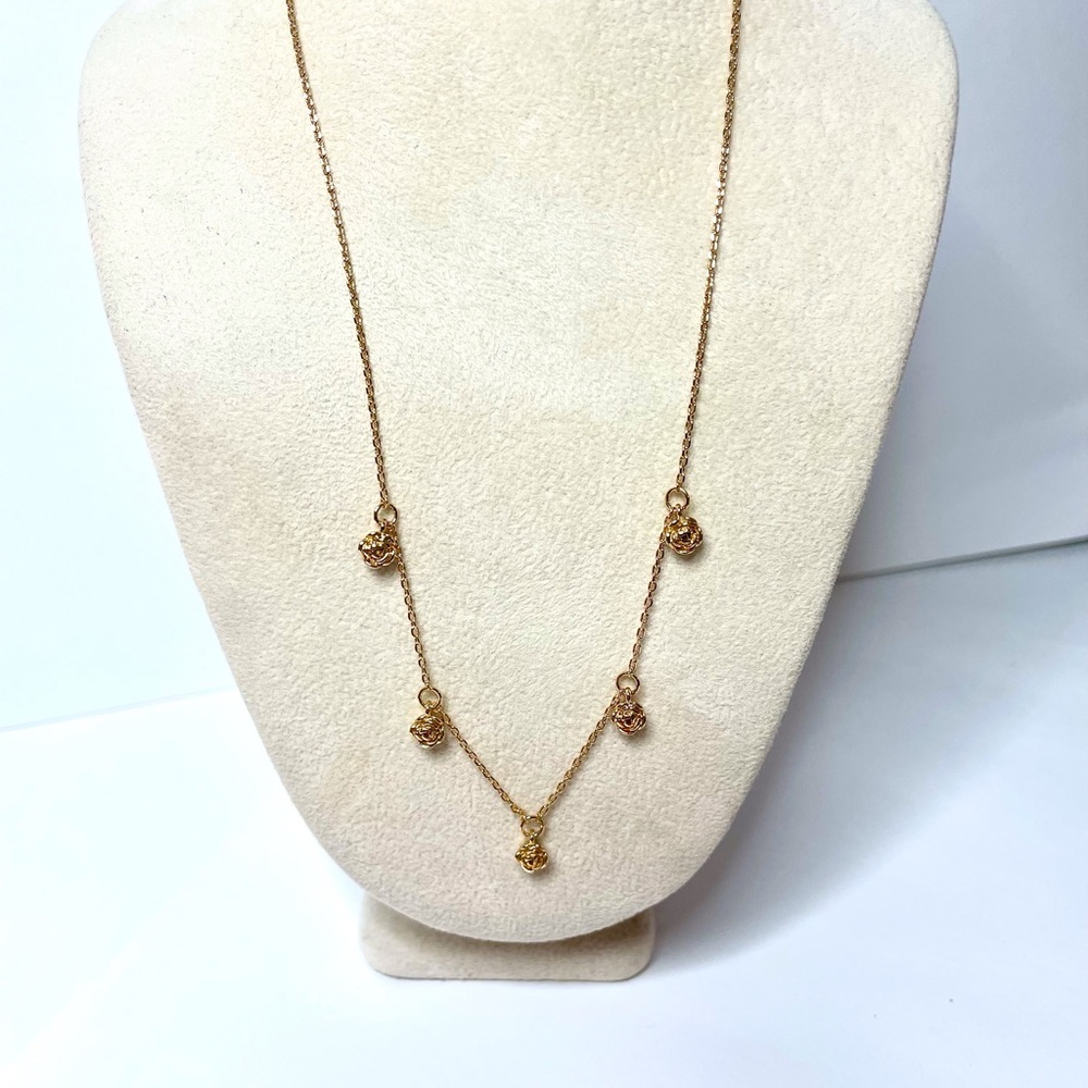 Elegant Gold Necklace with Delicate Charms